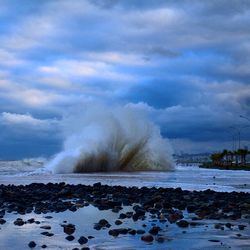 Scenic view of sea against cloudy sky