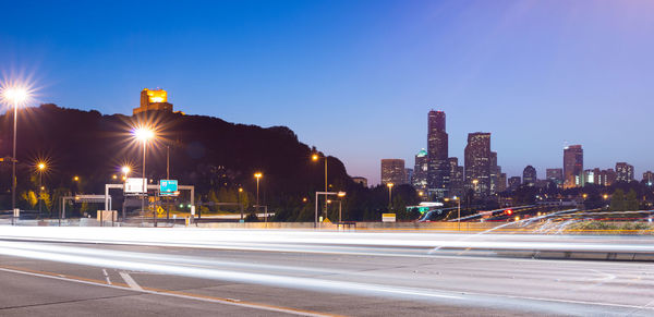 Light trails on road in city at night