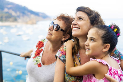 Close-up of smiling family looking up