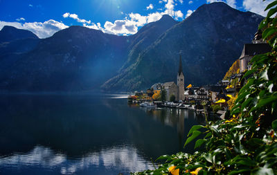 Scenic view of lake and mountains against sky