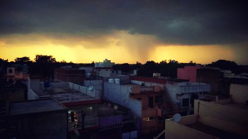 Cityscape against sky during sunset