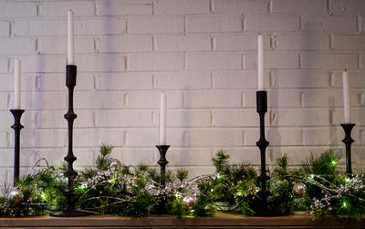Christmas holiday candlesticks on the fireplace mantle