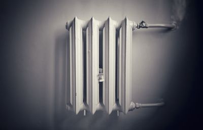 Close up of radiator hanging on wall