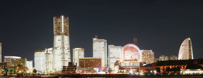 Illuminated buildings in city at night