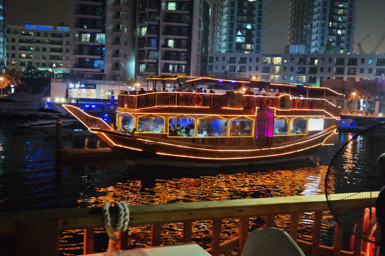 transportation, building exterior, nautical vessel, architecture, built structure, night, illuminated, mode of transport, water, canal, outdoors, real people, moored, large group of people, city, men, gondola - traditional boat, people