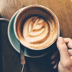 Close-up of coffee cup on table