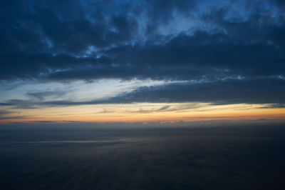 Scenic view of dramatic sky during sunset
