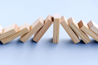 High angle view of wooden chairs against white background