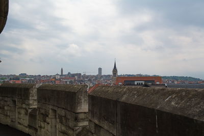 View of buildings against cloudy sky