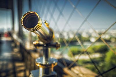 Close-up of metal fence against sky