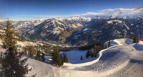 Scenic view of snowcapped mountains against sky during winter