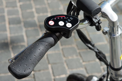 Close-up of bicycle parked on road