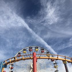 Low angle view of ferris wheel against sky