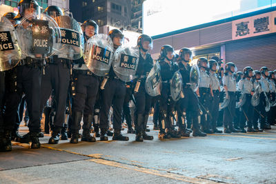 People standing on street in city