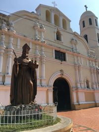 St. augustine statue against historic building cathedral