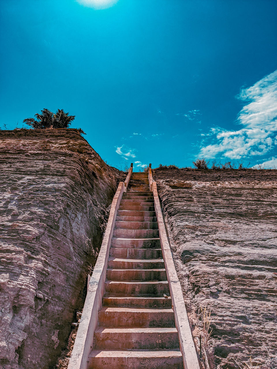 LOW ANGLE VIEW OF STEPS AGAINST SKY