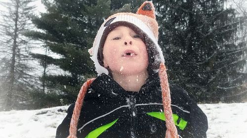 Portrait of smiling boy in snow