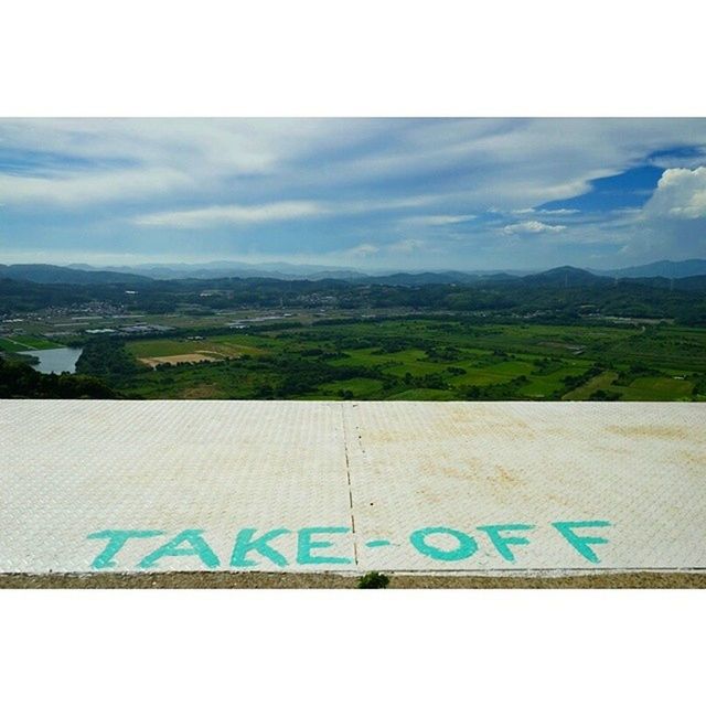 transfer print, text, western script, auto post production filter, mountain, sky, communication, landscape, mountain range, cloud - sky, day, cloud, no people, blue, nature, scenics, outdoors, information sign, tranquil scene, beauty in nature