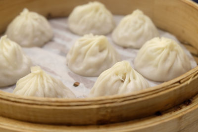 Close-up of dumplings in bamboo container