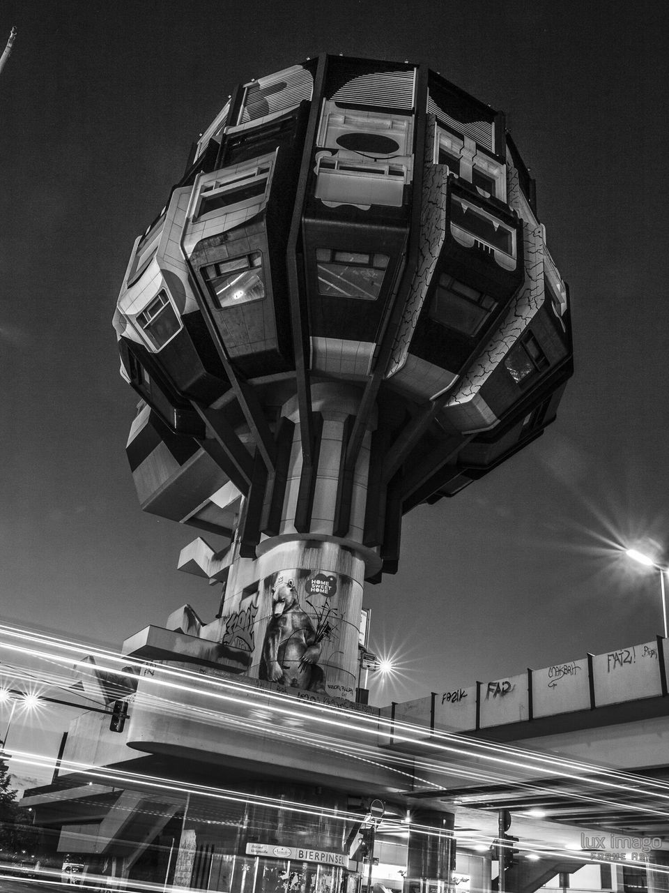 LOW ANGLE VIEW OF ILLUMINATED BUILT STRUCTURE