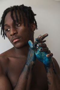 Artistic black man with painted hands