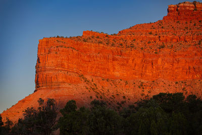 Rock formations on mountain against clear sky