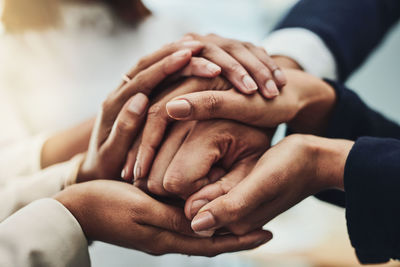 Cropped image of couple holding hands