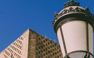 Low angle view of historic building against blue sky