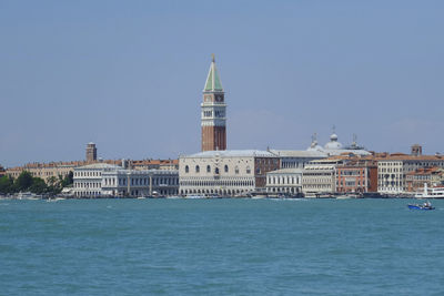 Piazza san marco by river against clear sky