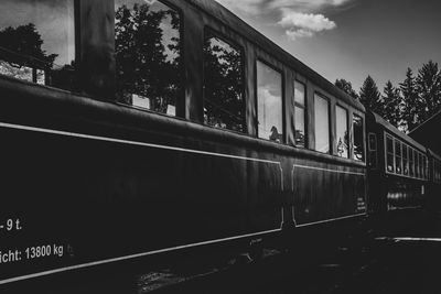 Train at railroad station against sky