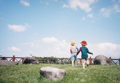 Scenic view of landscape against cloudy sky