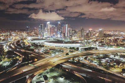 High angle view of illuminated buildings in city at night