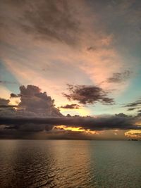 Scenic view of calm sea at sunset