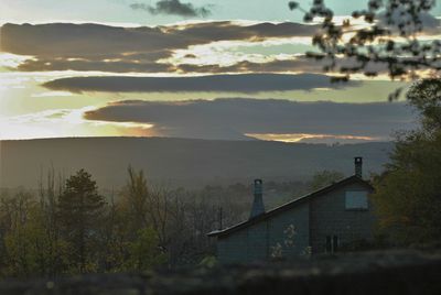 High angle view of trees and buildings against sky