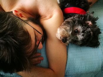 Portrait of woman with dog at home