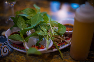 Close-up of chopped vegetables in plate on table
