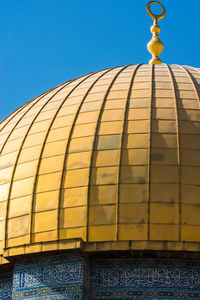 Low angle view of building against clear blue sky