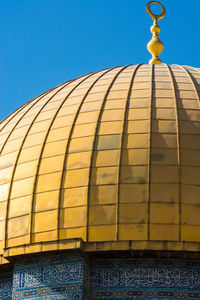 Low angle view of building against clear blue sky