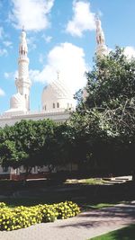 View of trees and buildings against sky