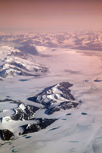 Aerial view of snowcapped mountain against sky