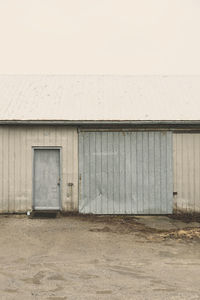 Abandoned barn against clear sky