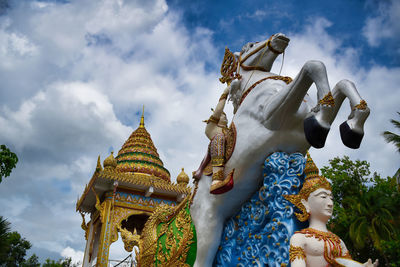 Statue of deity, god or goddess riding a horse at the wat chai chumphon chana songkhram temple