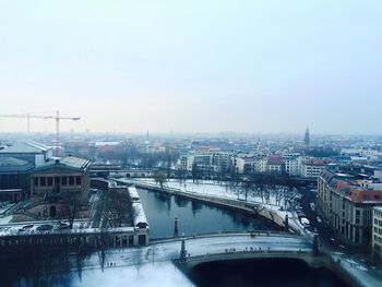 Cityscape against sky during winter