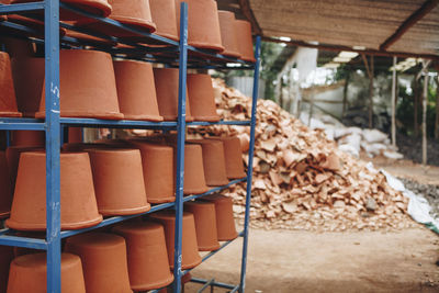 Clay pots on shelves at warehouse