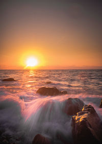 Scenic view of sea against sky during sunset