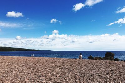 Scenic view of sea against blue sky