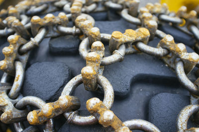 High angle view of rusty chains on tire