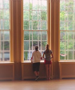 Woman standing by window