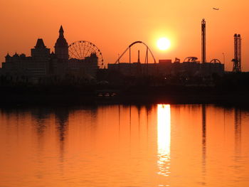 Amusement park on lakeshore at dusk