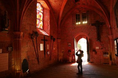 Women walking in corridor of building